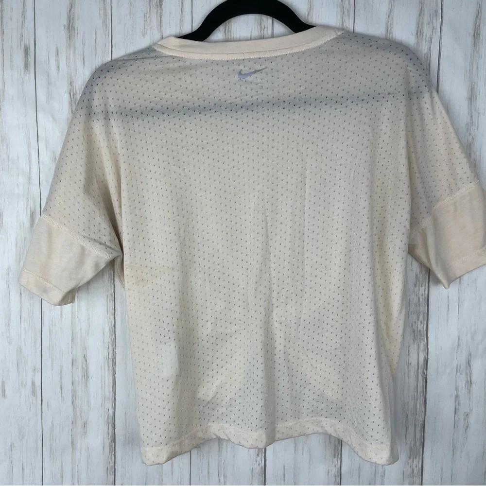 Nike cream medium perforated running crop top